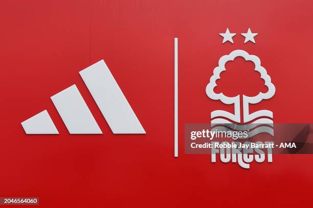 Adidas logo / branding seen next to Nottingham Forest badge / crest / emblem signage ahead f the Premier League match between Nottingham Forest and...