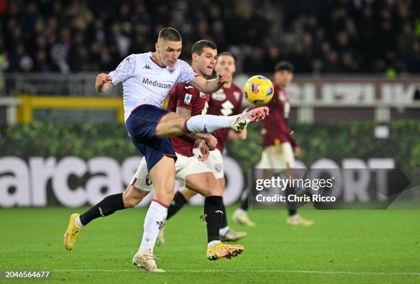 Nikola Milenkovic of ACF Fiorentina battles for the ball with Pietro Pellegri of Torino FC during the Serie A TIM match between Torino FC and ACF...