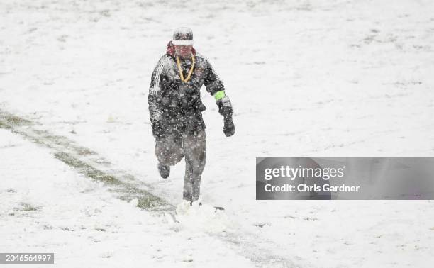 Stadium worker shovels the lines during the first half of the game between the Los Angeles Football Club and Real Salt Lake at the America First...