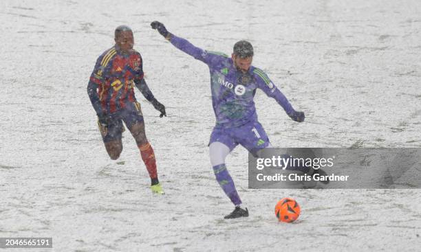 Goalkeeper Hugo Lloris of the Los Angeles Football Club clears the ball as he is pressured by Andres Gomez of Real Salt Lake during the first half of...