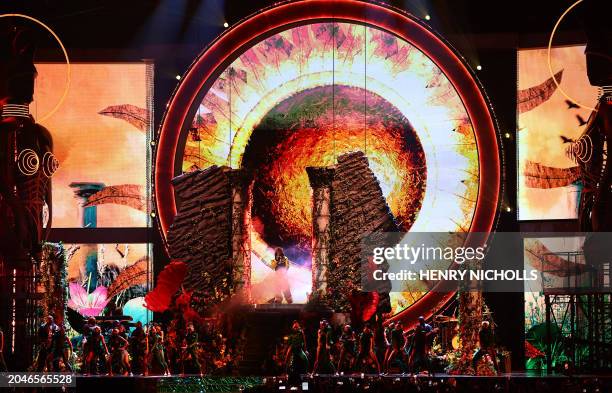 Nigerian rapper Rema performs on stage during BRIT Awards 2024 ceremony and live show in London on March 2, 2024. / RESTRICTED TO EDITORIAL USE NO...