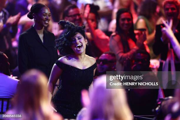 British singer-songwriter Rachel Keen, known as Raye reacts as she goes to collect her award for the song of the year for "Escapism." during BRIT...