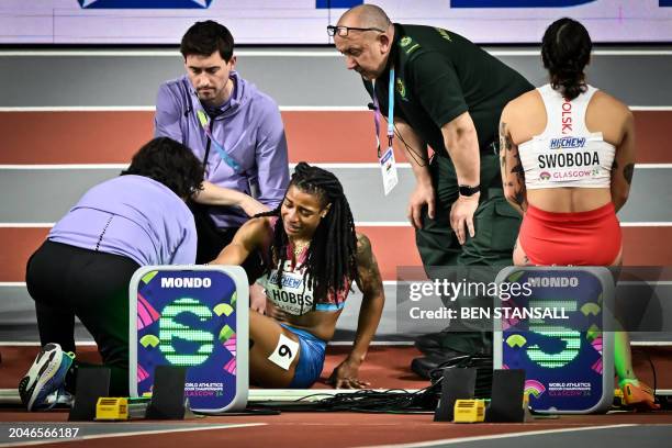 S Aleia Hobbs receives medical attention after injuring herself during the warm up prior to the Women's 60m final during the Indoor World Athletics...