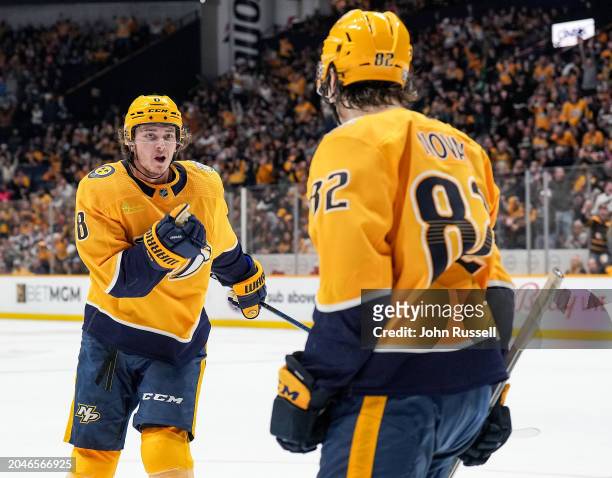 Cody Glass celebrates his goal with Tommy Novak of the Nashville Predators against the Colorado Avalanche during an NHL game at Bridgestone Arena on...