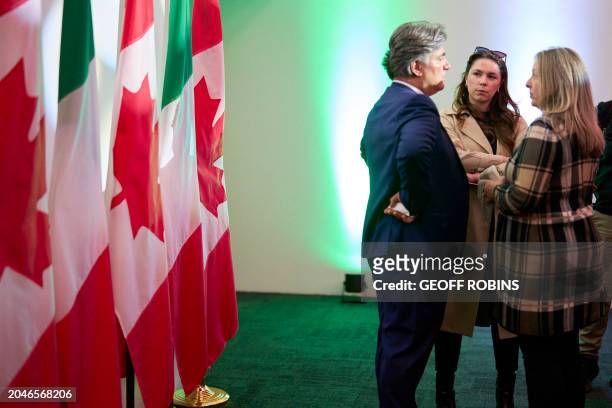 Jenna Ghassabeh, Press Secretary at the Office of the Prime Minister of Canada speaks with other government officials during a reception for Canadian...