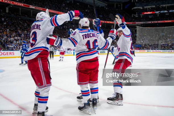 Vincent Trocheck of the New York Rangers celebrates his goal against the Toronto Maple Leafs with teammates Alexis Lafreniere and Erik Gustafsson...