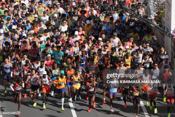 Runners fill the street in front of the Tokyo Metropolitan Government Building at the start of the Tokyo Marathon 2024 in Tokyo on March 3, 2024.