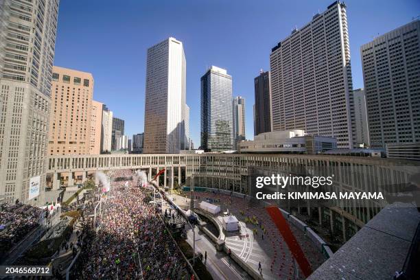 Runners fill the street in front of the Tokyo Metropolitan Government Building at the start of the Tokyo Marathon 2024 in Tokyo on March 3, 2024.