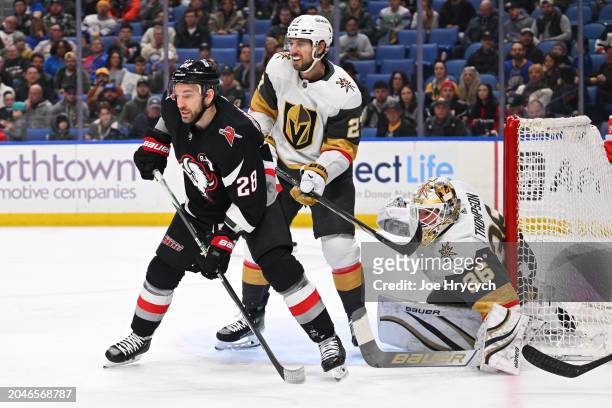 Shea Theodore and Logan Thompson of the Vegas Golden Knights defend against Zemgus Girgensons of the Buffalo Sabres during an NHL game on March 2,...