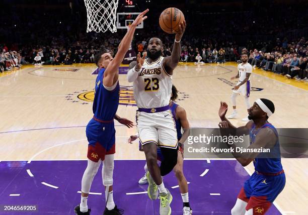 LeBron James of the Los Angeles Lakers scores his 40,000th career point during the first half against Michael Porter Jr. #1 of the Denver Nuggets at...