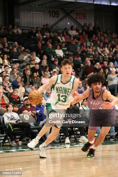 Drew Peterson of the Maine Celtics drives against PLAYER XX of the Wisconsin Herd during an NBA G-League game on March 02, 2024 at The Oshkosh Arena...