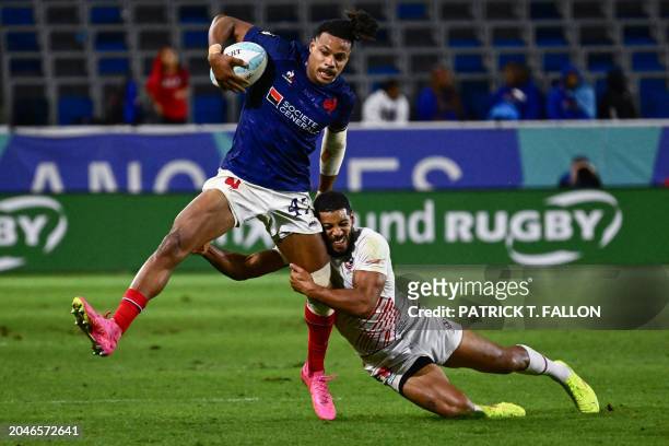 France's Jefferson Lee Joseph is tackled by USA's Malacchi Esdale during the 2024 HSBC Rugby Sevens LA tournament match between USA and France at...