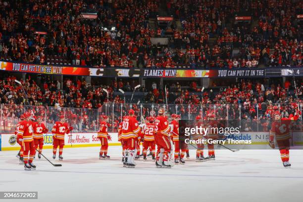 Teammates of the Calgary Flames celebrate a w against the Pittsburgh Penguins at the Scotiabank Saddledome on March 02, 2024 in Calgary, Alberta.