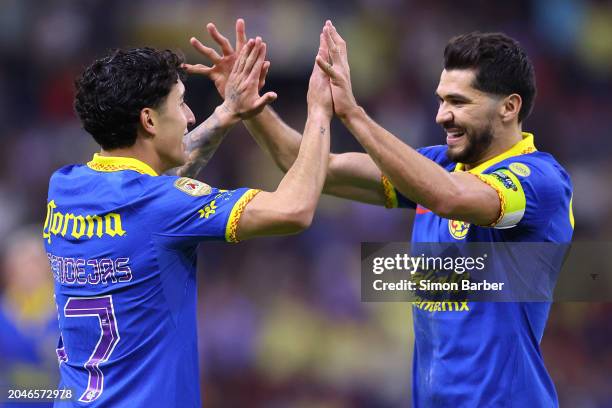 Alejandro Zendejas of America celebrates after scoring the team's third goal with Henry Martin during the 10th round match between Atlas and America...