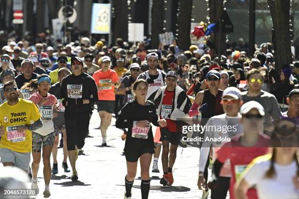 Runners are seen crossing the Tokyo Marunouchi district before arriving at the finish line of the Tokyo Marathon on March 3 in Tokyo, Japan.