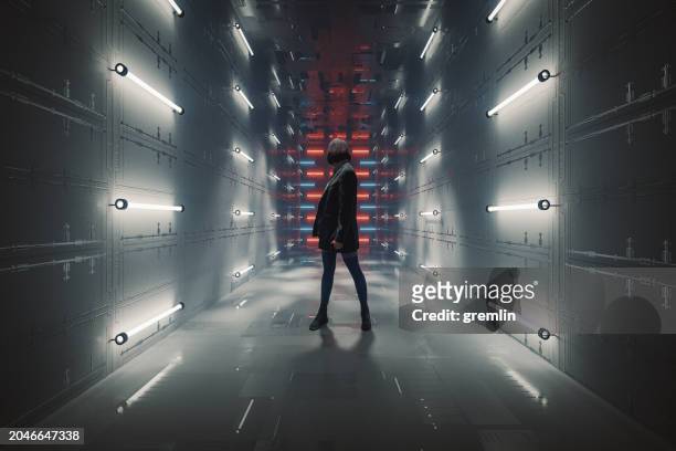 young casual woman standing in futuristic corridor - abstract geometric silhouette woman stock pictures, royalty-free photos & images