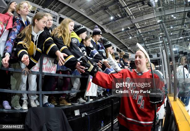 Aneta Tejralová of Ottawa greets a girls youth team after warm-up at The Arena at TD Place on February 28, 2024 in Ottawa, Ontario.