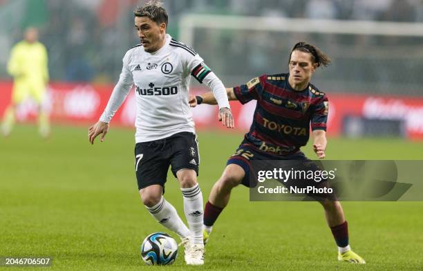 Josue Pesqueira and Leonardo Koutris are playing during the Legia Warsaw vs. Pogon Szczecin PKO Ekstraklasa match in Warsaw, Poland, on March 2, 2024.