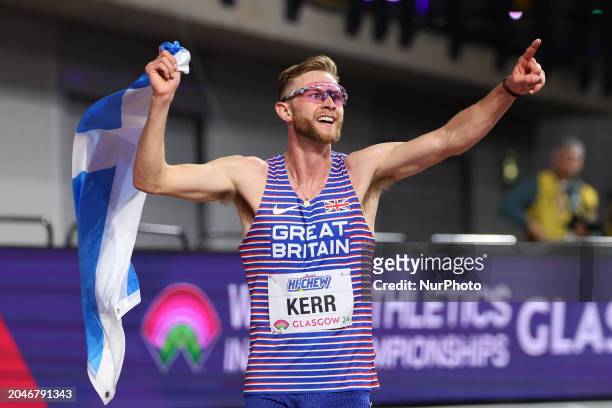 Josh Kerr is celebrating winning gold with the Saltire during the 2024 World Athletics Championships at the Emirates Arena in Glasgow, Scotland, on...