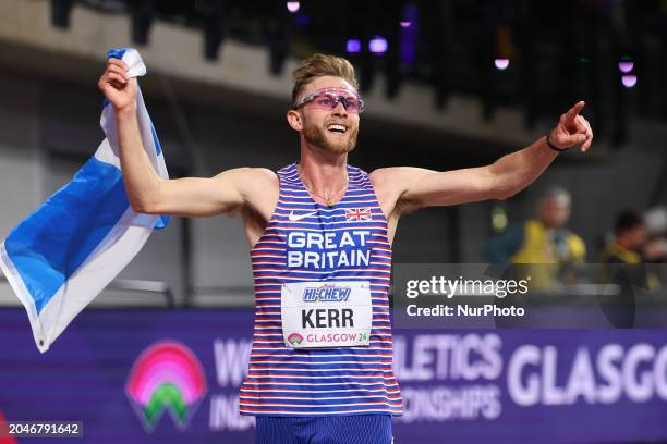 Josh Kerr is celebrating winning gold with the Saltire during the 2024 World Athletics Championships at the Emirates Arena in Glasgow, Scotland, on...