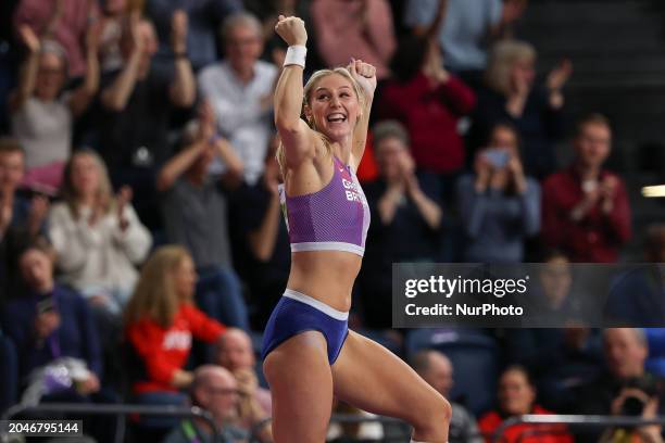 Molly Caudery from Great Britain, competing in pole vault, is celebrating a clearance and saluting the crowd at the 2024 World Athletics...