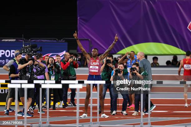 Grant Holloway from the USA is celebrating his gold medal win in the 60 meters hurdles at the 2024 World Athletics Championships in the Emirates...