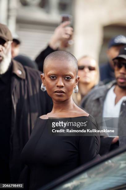 Kelela wears blac dress and transparent drop shape earrings outside Courreges during the Womenswear Fall/Winter 2024/2025 as part of Paris Fashion...