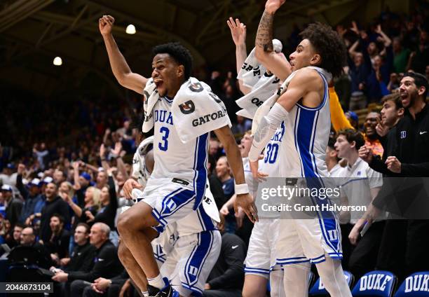 The Duke Blue Devils bench cheers on the reserves during the final minute of the second half of the game against the Louisville Cardinals at Cameron...