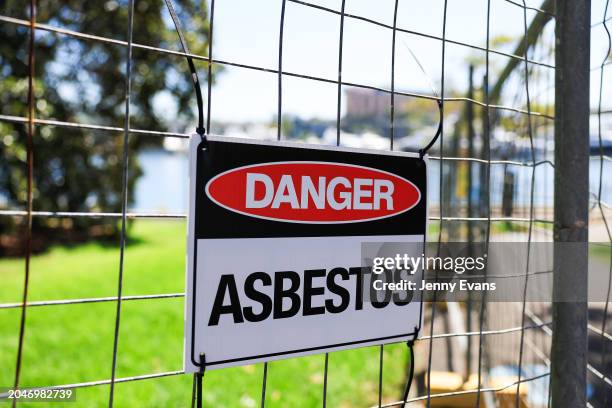 An asbestos warning sign is seen along the foreshore at Bicentennial Park in Glebe on February 29, 2024 in Sydney, Australia. At least 34 sites...