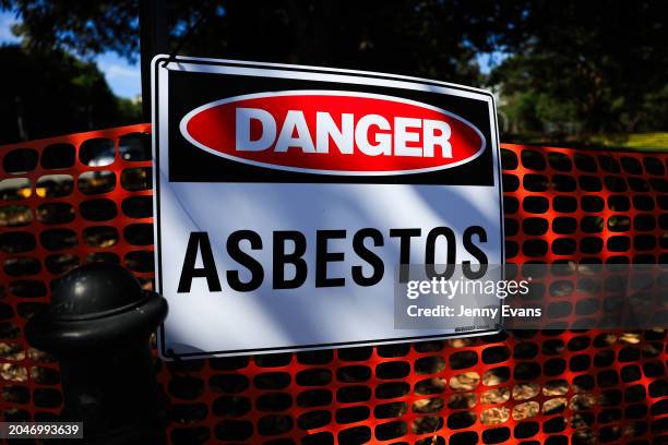 An asbestos warning sign is seen at Victoria Park in Camperdown on February 29, 2024 in Sydney, Australia. At least 34 sites across Sydney, including...