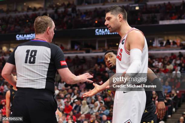 Donovan Mitchell of the Cleveland Cavaliers reacts as Nikola Vucevic of the Chicago Bulls argues with referee Matt Boland during the second half at...