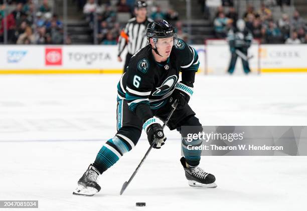 Ty Emberson of the San Jose Sharks skates with the puck against the New Jersey Devils during the second period of an NHL hockey game at SAP Center on...