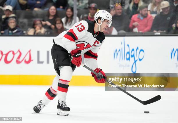 Nico Hischier of the New Jersey Devils skates with the puck against the San Jose Sharks during the third period of an NHL hockey game at SAP Center...