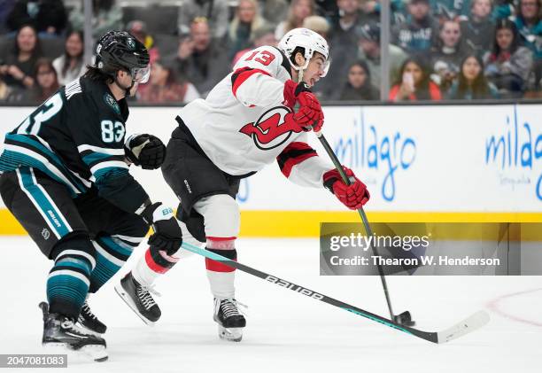 Nico Hischier of the New Jersey Devils shoots on goal against the San Jose Sharks during the third period of an NHL hockey game at SAP Center on...