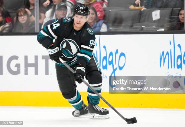 Alexander Barabanov of the San Jose Sharks skates with the puck against the New Jersey Devils during the second period of an NHL hockey game at SAP...