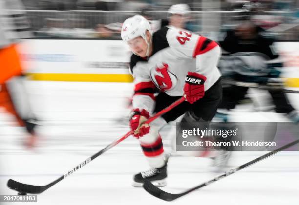 Curtis Lazar of the New Jersey Devils skates with the puck against the San Jose Sharks during the first period of an NHL hockey game at SAP Center on...