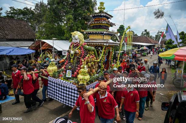 Indonesians parade a float of durian and other produce during the durian festival in Wonosalam village in Jombang, eastern Java Island on March 3,...