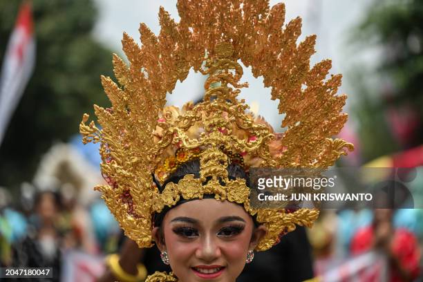 Dancer participates in a parade during the durian festival in Wonosalam village in Jombang, eastern Java Island on March 3, 2024. Grown across...