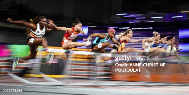Athletes competes in the Women's 60m hurdles heats during the Indoor World Athletics Championships in Glasgow, Scotland, on March 3, 2024.