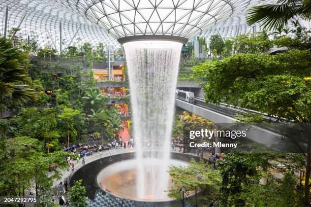 the jewel changi singapore rain vortex waterfall - singapore city people stock pictures, royalty-free photos & images