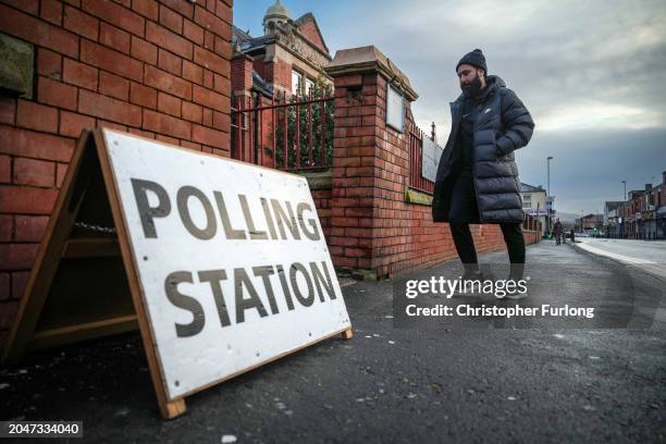 Voter arrives at a polling station to vote in the Rochdale by-election on February 29, 2024 in Rochdale, England. The Rochdale by-election takes...