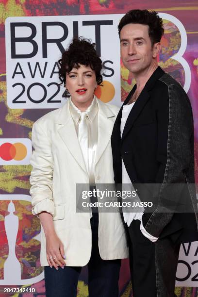 Irish radio DJ Annie Mac and British television presenter Nick Grimshaw pose on the red carpet upon arrival for the BRIT Awards 2024 in London on...