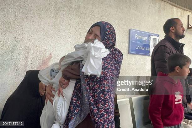 Palestinian woman Rana Abu Anze mourns after losing her husband and 4-month-old twin babies after Israeli strike hitting the house of Abu Anze family...