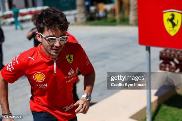 Charles Leclerc of Monaco and Scuderia Ferrari runs to the Ferrari hospitality suite during practice ahead of the F1 Grand Prix of Bahrain at Bahrain...