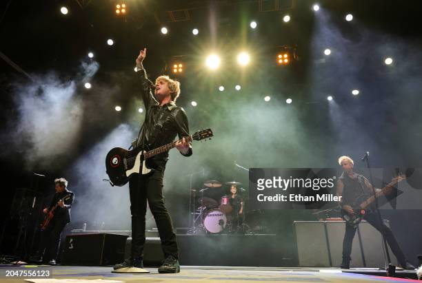 Jason White, Billie Joe Armstrong, Tre Cool and Mike Dirnt of Green Day perform during EA Sports' The Madden Bowl at the House of Blues Las Vegas...