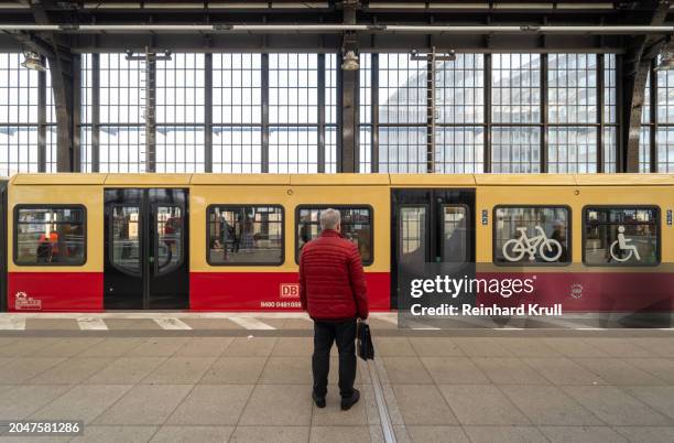 rear view of man standing in front of subway train - reinhard krull stock pictures, royalty-free photos & images