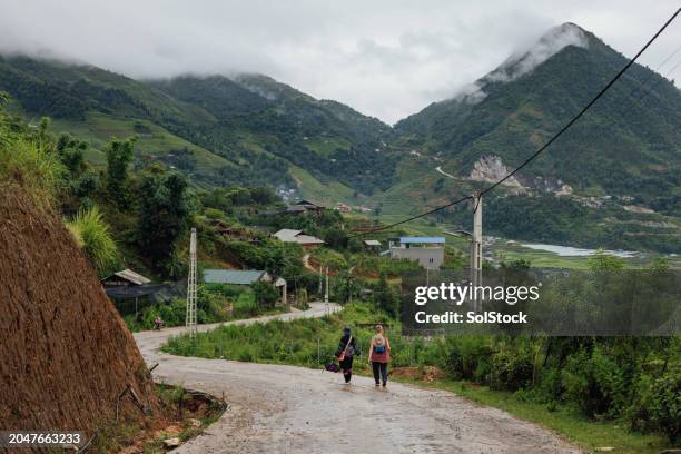 walking through sa pa with a local guide - sapa vietnam stock pictures, royalty-free photos & images