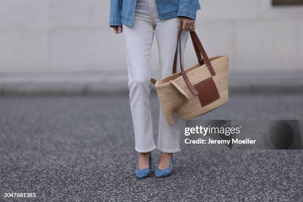 Leo Eberlin seen wearing Leo Mathild diamond jewelry, Ganni creamy white wool knit top, Sézane blue denim jacket, & Other Stories white denim...