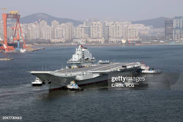 Aircraft carrier Liaoning sets for sea trial at Dalian shipyard with the help of towboats after nearly one year of maintenance on February 29, 2024...