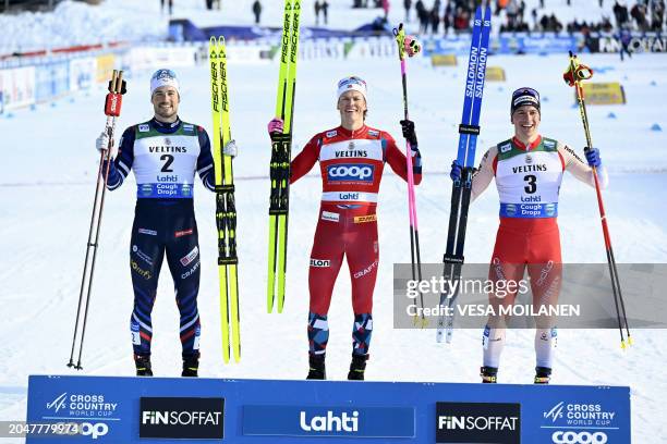 Winner Johannes Klaebo of Norway , second placed Lucas Chanavat of France and third placed Valerio Grond of Switzerland celebrate on the podium after...